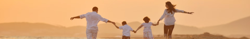 Children holding hands at sunset, enjoying a warm moment.