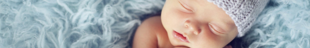 Close-up of a baby's face showing smooth skin and lips.